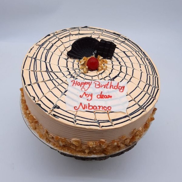 SweeT TemptationS by Rashi - A birthday cake from a loving husband to his  loving wife... flavor:: butterscotch cake with butterscotch pudding and  chocolate frosting.. a white chocolate collar around the cake.. #